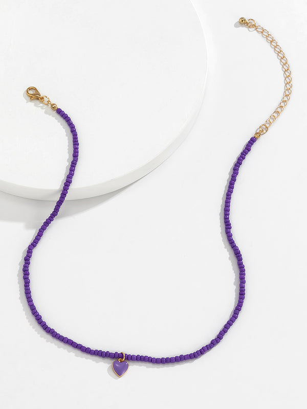Collier à perles, couleur unie