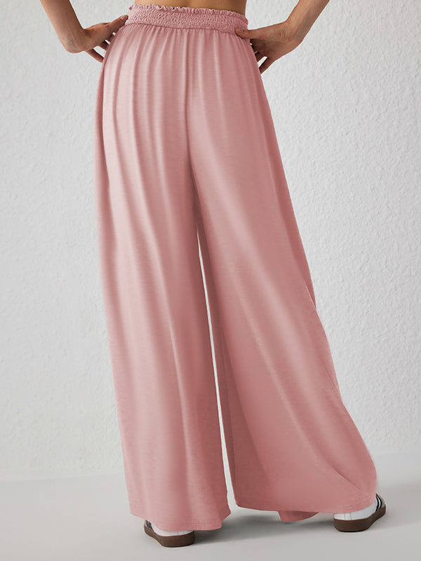 Pantalon ample plissé taille haute, à poches, à empiècements, couleur unie
