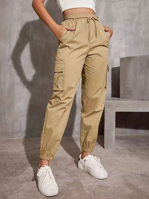 Pantalon taille haute, à taille élastique, à poches, à empiècements, à taille nouée, couleur unie