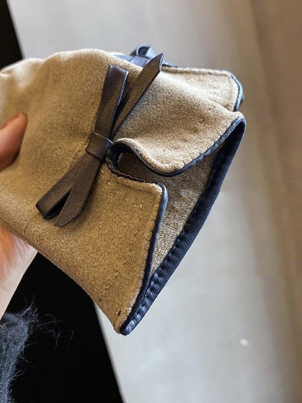 Gants à empiècements ornés d'un nœud