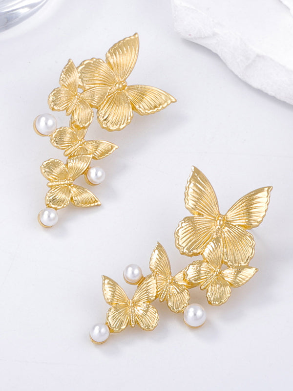 Boucles d'oreilles brillantes en forme de papillon
