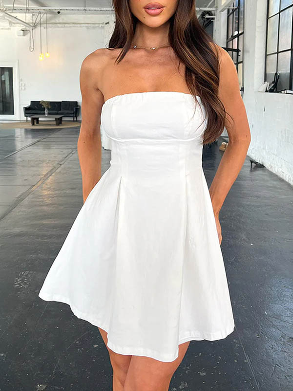 Robe courte ample plissée nouée coupe trapèze, dos nu, à empiècements, bustier, couleur unie