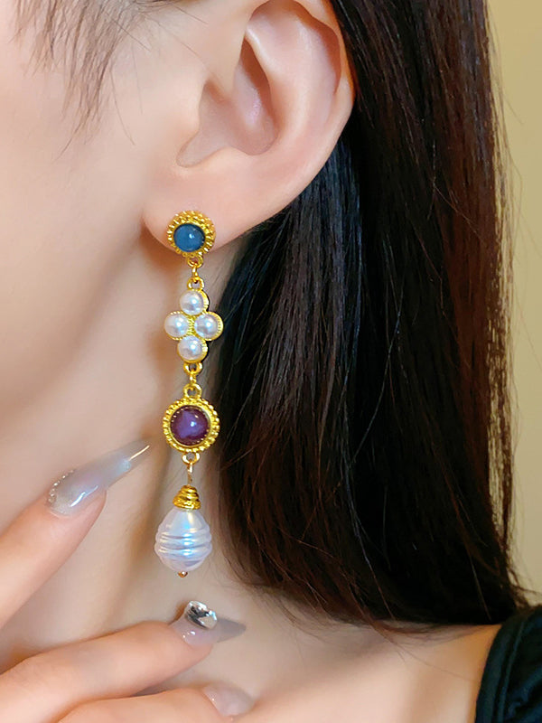Boucles d'oreilles pendantes géométriques à pompons
