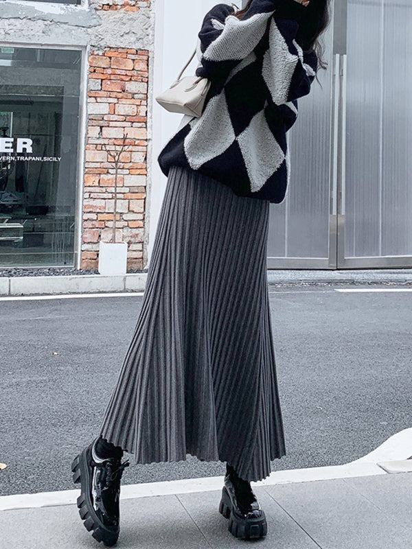 Jupe plissée coupe trapèze, taille haute, couleur unie