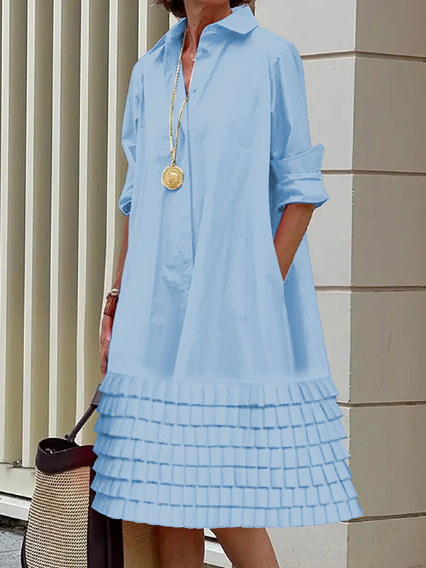 Robe chemise superposée plissée coupe trapèze, à manches longues, à poches, à empiècements, à col revers, couleur unie