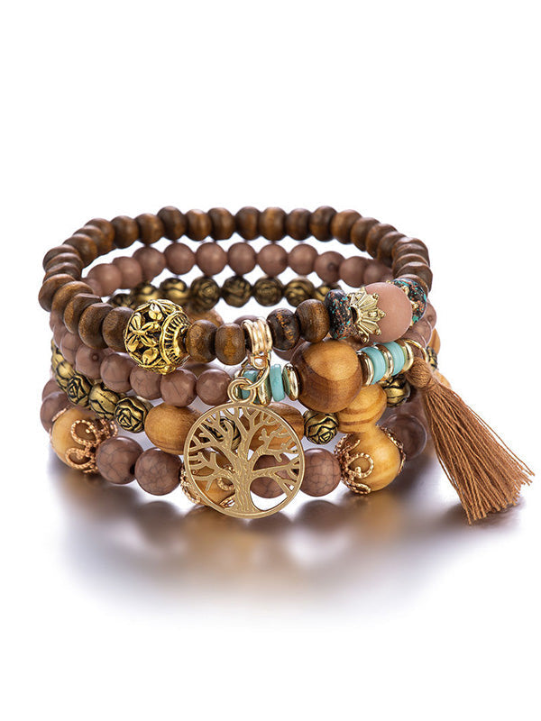 Bracelet bohémien multicouche en perles de bois fait à la main avec pompons
