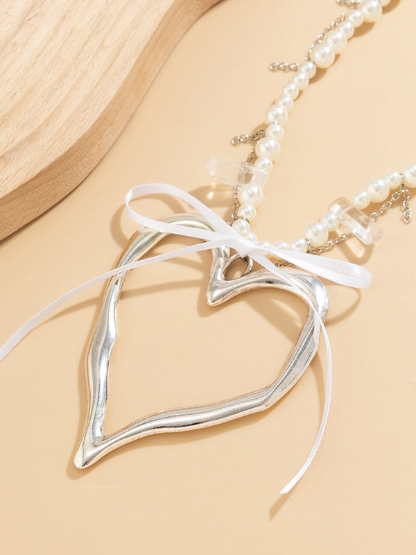 Collier perlé délicat en forme de cœur