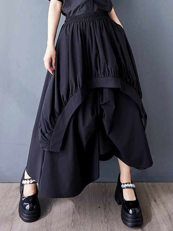 Jupe ample asymétrique plissée coupe trapèze, à taille élastique, à poches, couleur unie