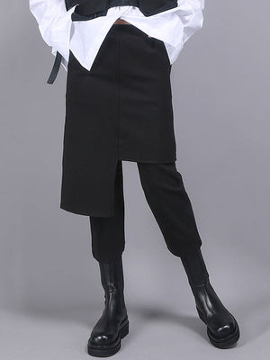 Jupe-culotte noire asymétrique taille empire, effet deux pièces