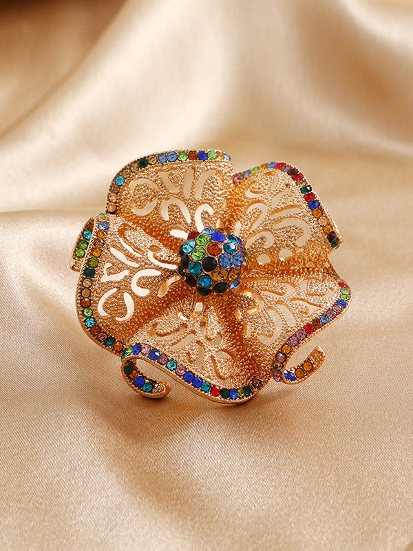 Bague réglable ajourée en forme de fleur, à strass