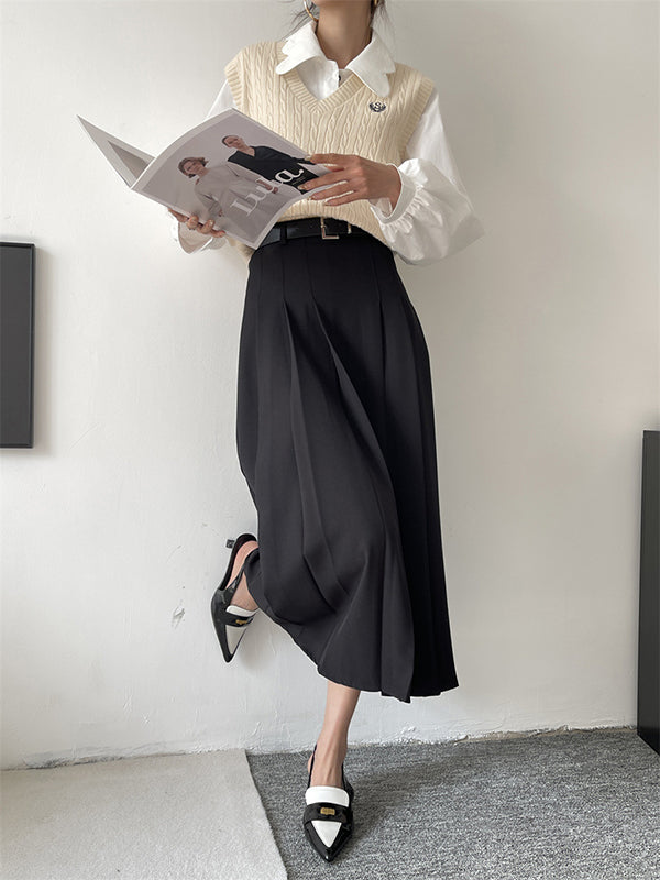 Jupe plissée coupe trapèze, taille haute, à empiècements, couleur unie