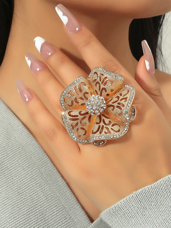 Bague réglable ajourée en forme de fleur, à strass