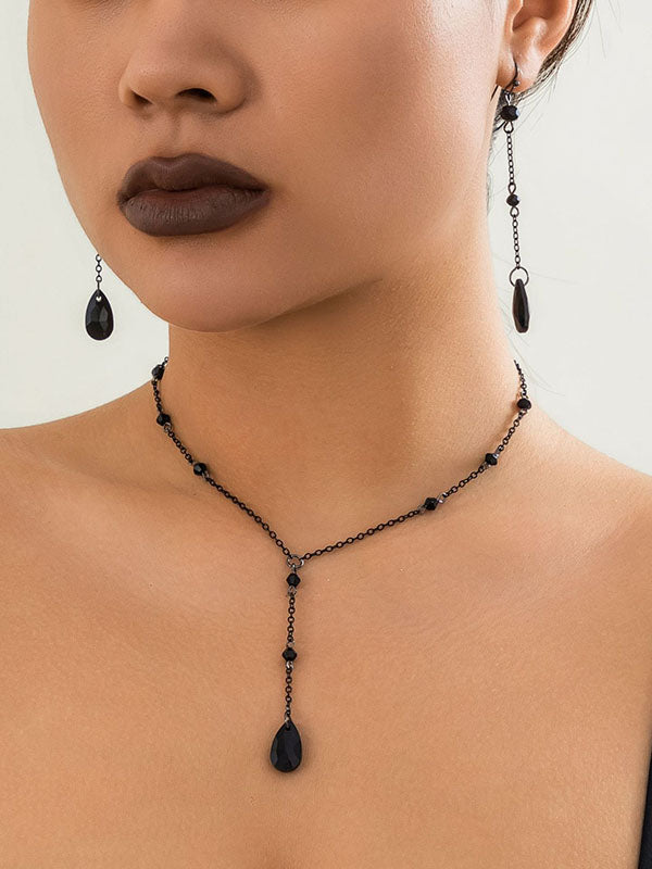 Boucles d'oreilles pendantes géométriques à pompons