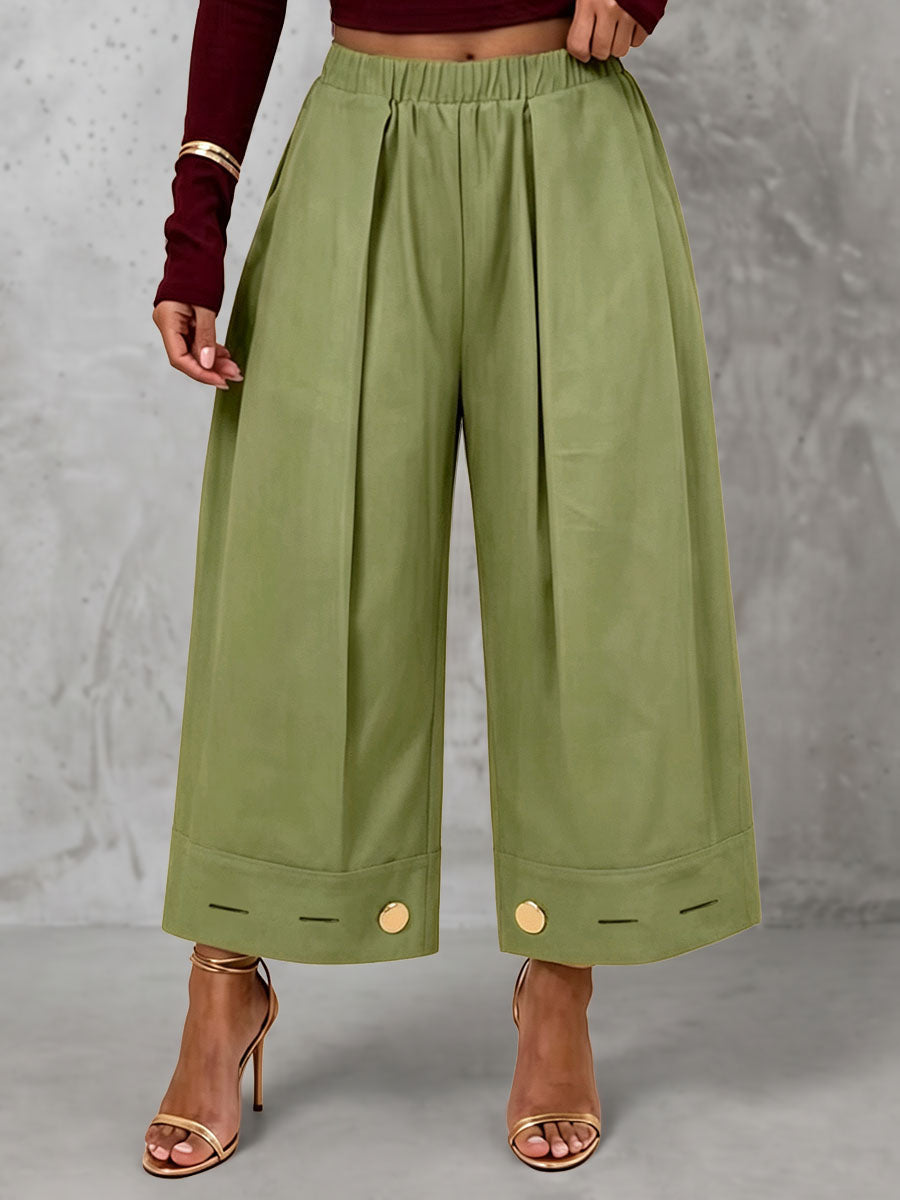 Pantalon plissé boutonné ample à poches, à taille élastique, à jambes larges, couleur unie