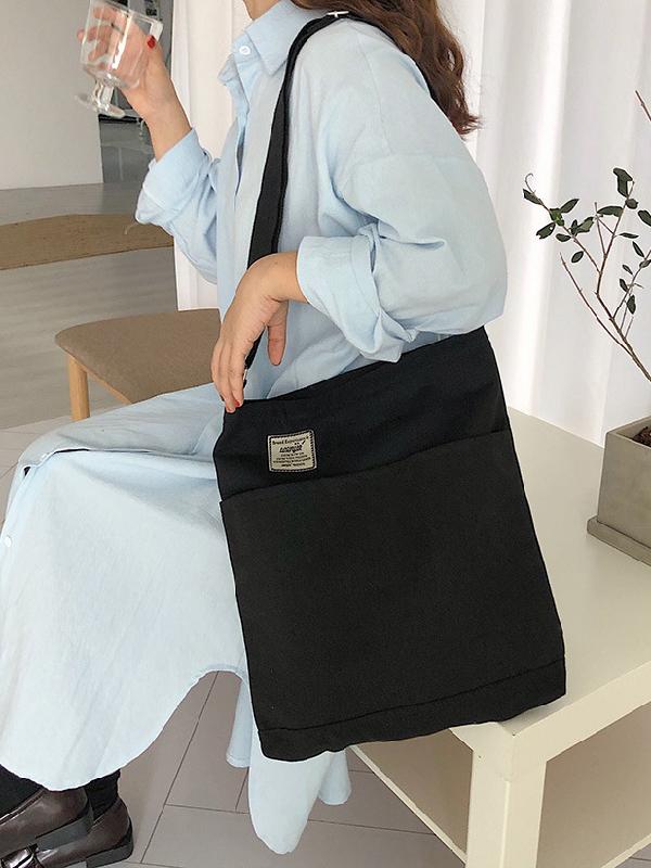 Sac à main simple en toile de couleur unie avec poches