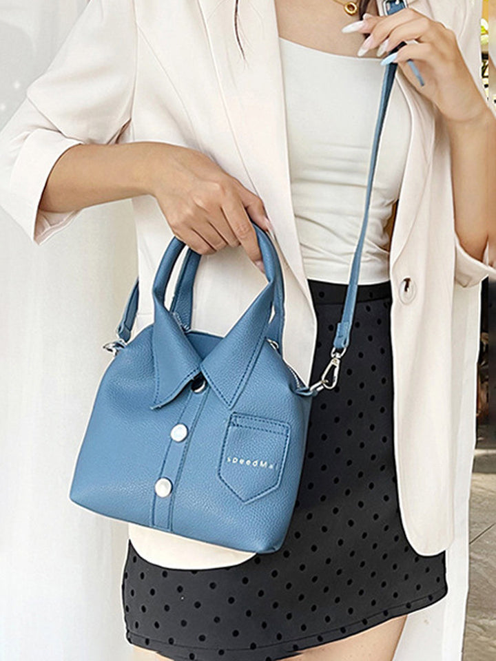 Sac à main bandoulière géométrique boutonné couleur unie