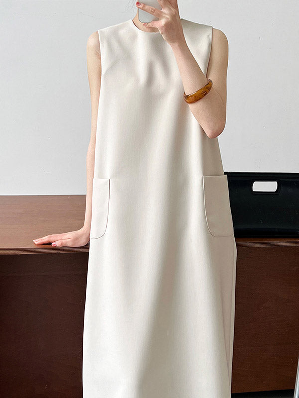 Robe mi-longue ample fendue dans le dos taille haute, à poches, à fermeture éclair, à col rond, couleur unie