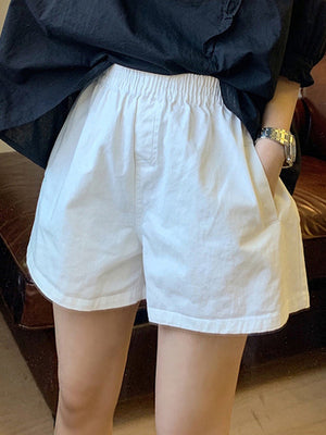 Short ample taille haute, à taille élastique, à empiècements, couleur unie