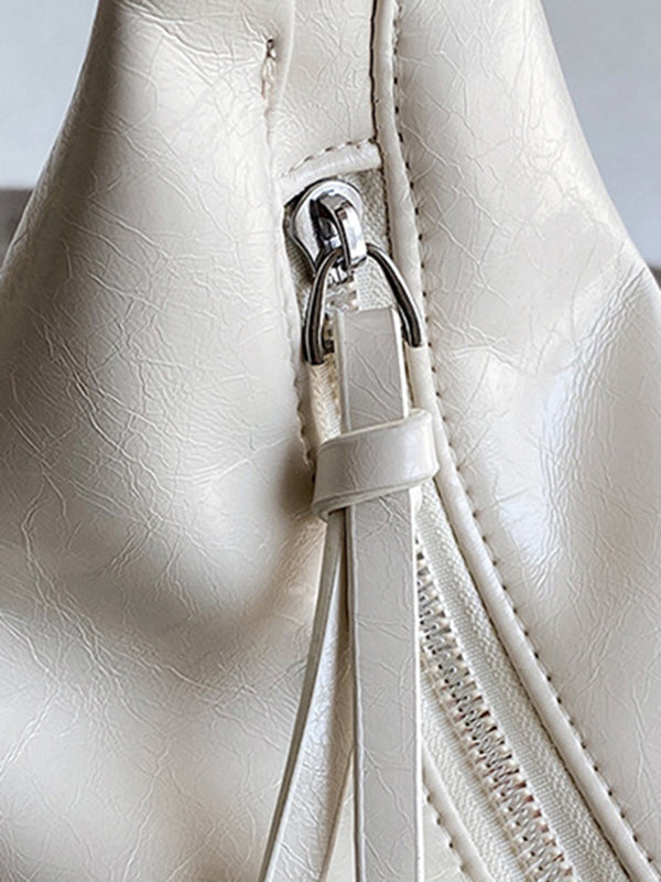 Sac bandoulière géométrique à empiècements, à fermeture éclair