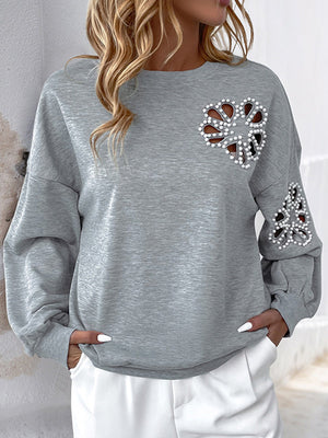 Sweat-shirt ample asymétrique ajouré à manches bouffantes, à empiècements, à col rond