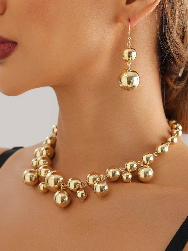 Parure collier et boucles d'oreilles à empiècements