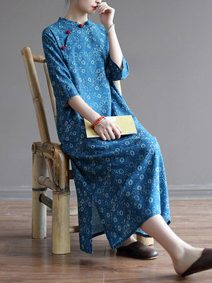 Robe mi-longue originale à col montant et motif floral uni
