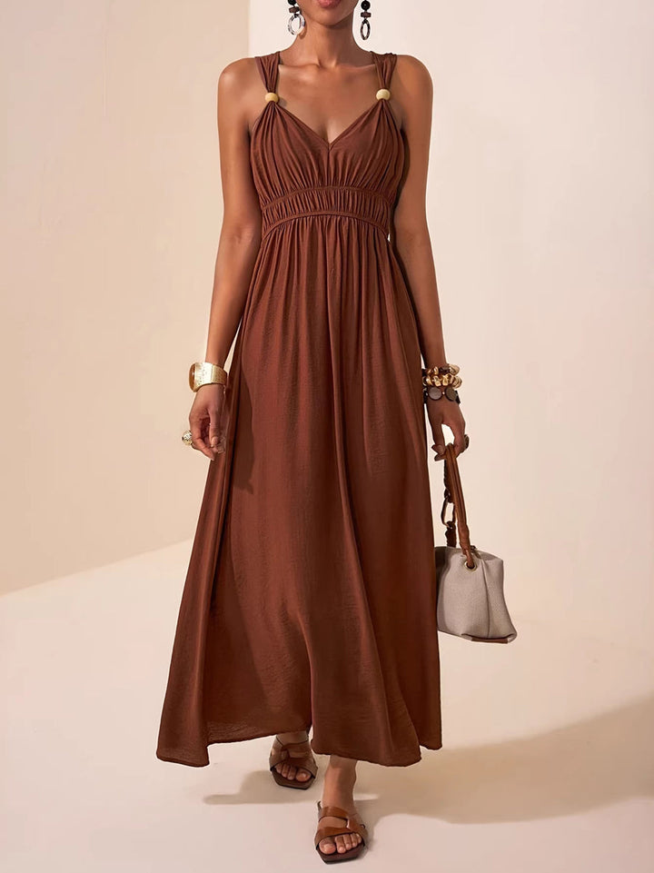 Robe longue ample plissée coupe trapèze, à fines bretelles, couleur unie
