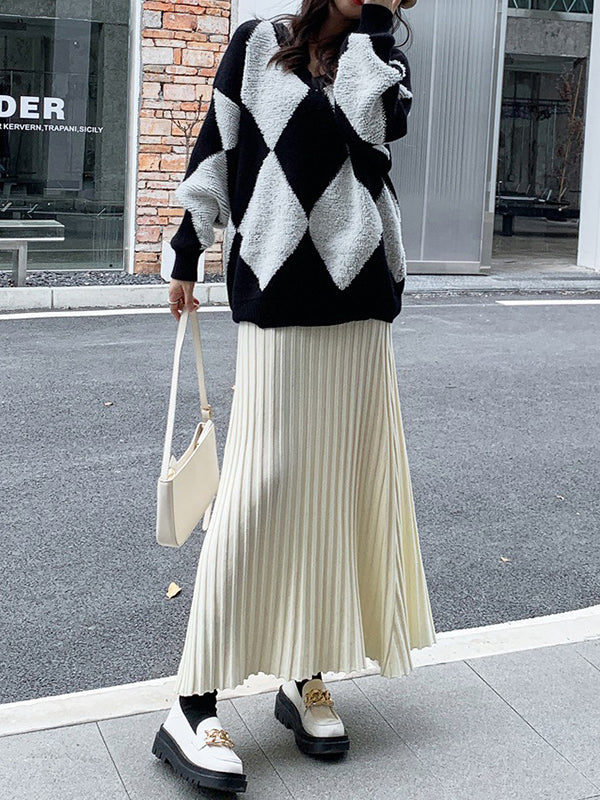 Jupe plissée coupe trapèze, taille haute, couleur unie