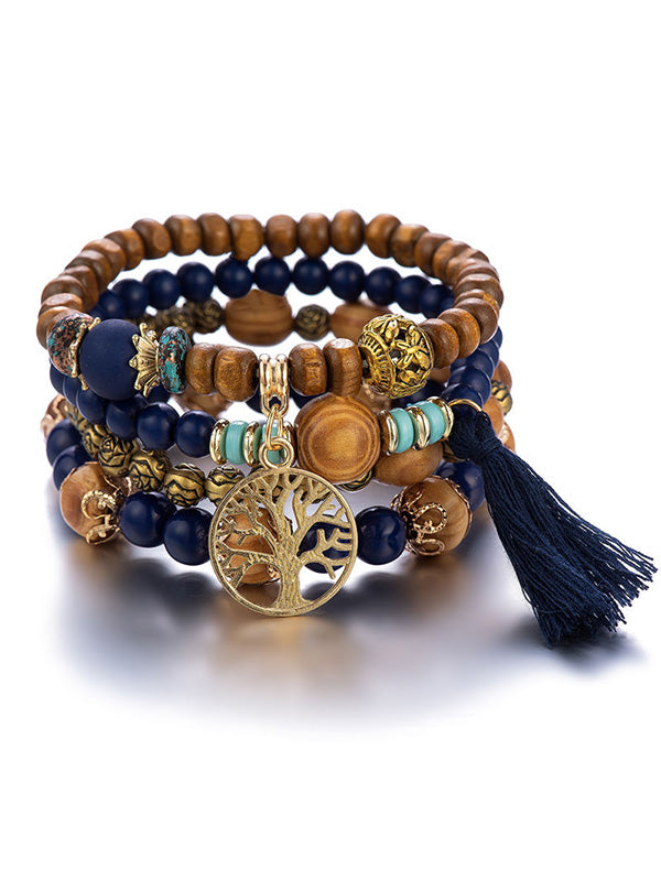 Bracelet bohémien multicouche en perles de bois fait à la main avec pompons