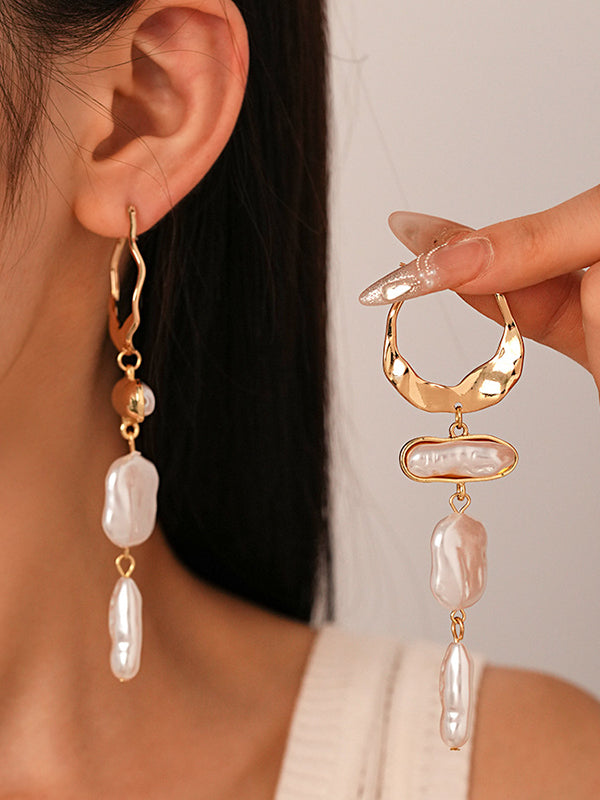 Boucles d'oreilles géométriques à pompons