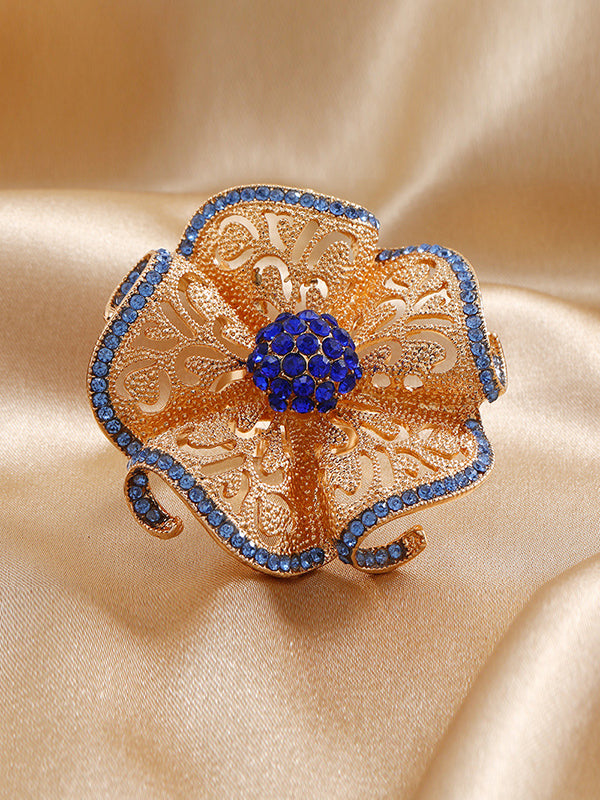Bague réglable ajourée en forme de fleur, à strass