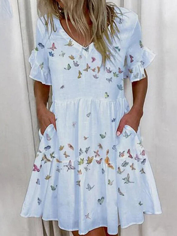Robe mi-longue plissée imprimée coupe trapèze, taille haute, à poches, à empiècements, à col en V, couleur contrastée
