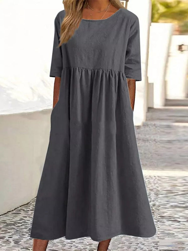 Robe mi-longue plissée coupe trapèze, à manches mi-longues, à poches, à col rond, couleur unie