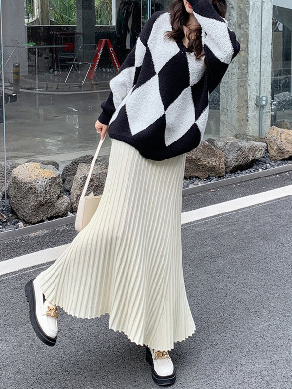 Jupe plissée coupe trapèze, taille haute, couleur unie