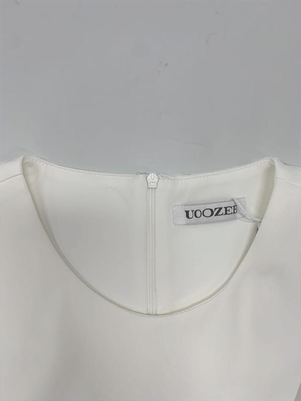 Robe longue ample sans manches, à poches, à empiècements, à col rond, couleur unie
