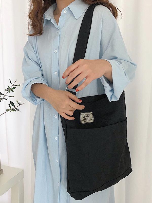 Sac à main simple en toile de couleur unie avec poches