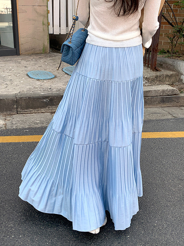 Jupe plissée coupe trapèze, taille haute, à empiècements, couleur unie