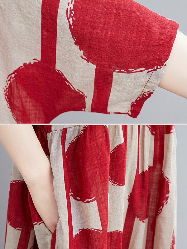 Robe mi-longue à pois, à empiècements, à col rond