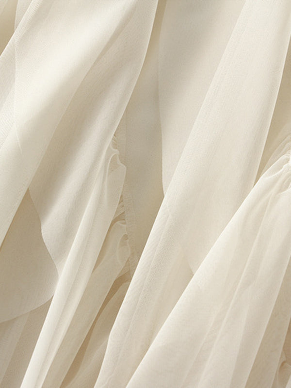 Jupe ample plissée coupe trapèze, à taille élastique, en gaze, à empiècements, couleur unie