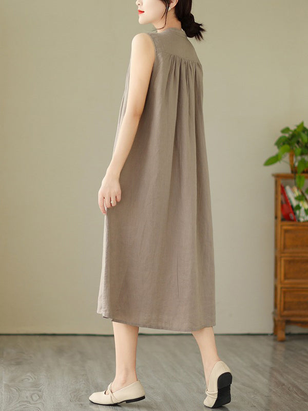 Robe mi-longue boutonnée plissée coupe trapèze, sans manches, à col rond, couleur unie