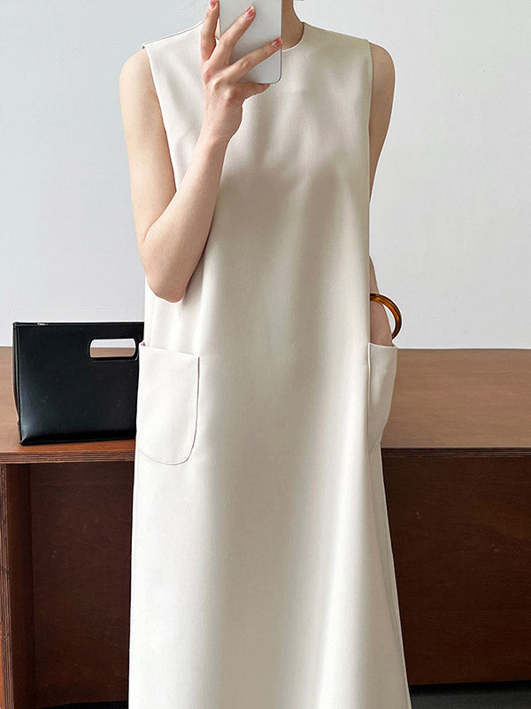 Robe mi-longue ample fendue dans le dos taille haute, à poches, à fermeture éclair, à col rond, couleur unie