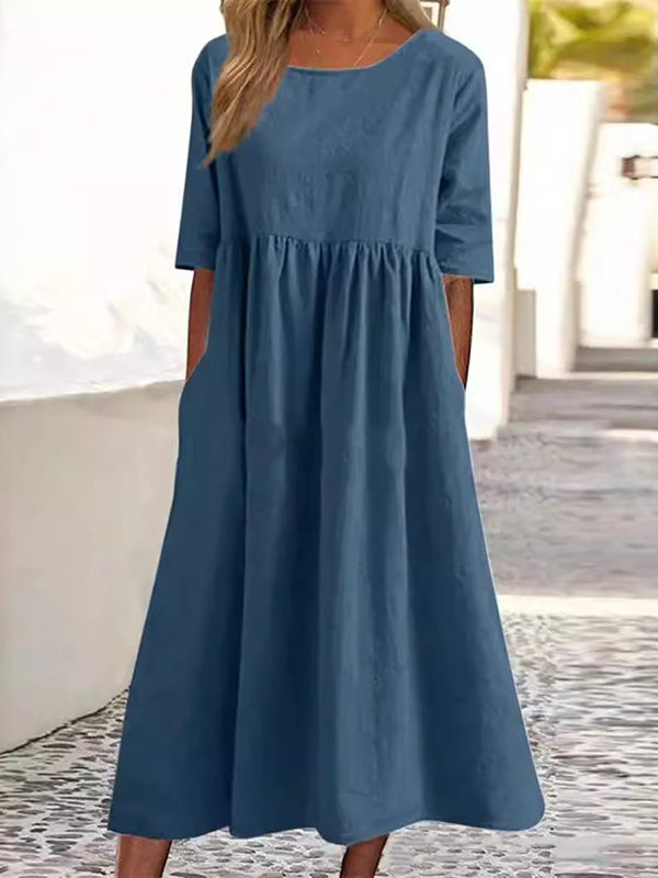 Robe mi-longue plissée coupe trapèze, à manches mi-longues, à poches, à col rond, couleur unie