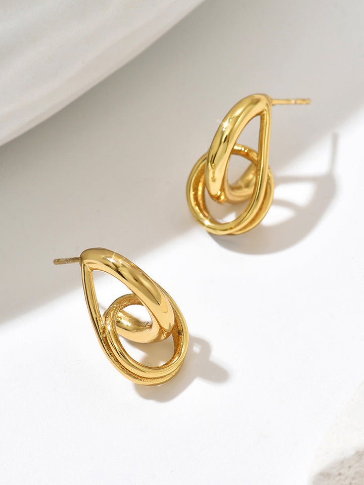Boucles d'oreilles pendantes géométriques ajourées en forme de goutte