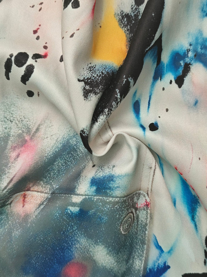 Bas de pantalon en Jean taille haute, jambe large, boutonné, couleur contrastée, poches imprimées graffitis