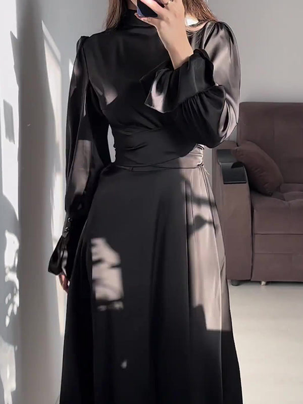 Robe longue plissée coupe trapèze, à manches longues, à taille nouée, à fermeture éclair, à col cheminée, couleur unie