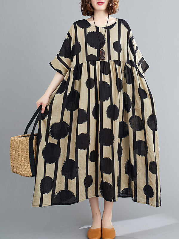 Robe mi-longue à pois, à empiècements, à col rond