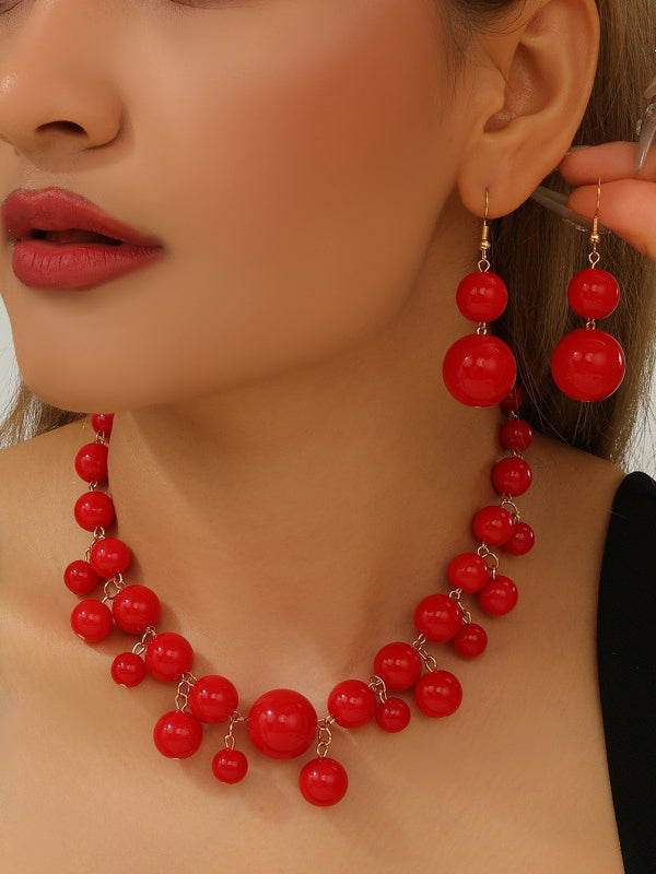 Parure collier et boucles d'oreilles à empiècements
