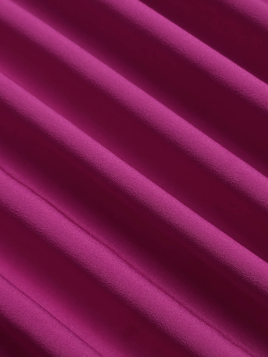 Robe longue ample plissée à manches longues, à empiècements, à volants étagés, à col rond, couleur unie