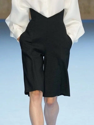 Short ample à poches, couleur unie