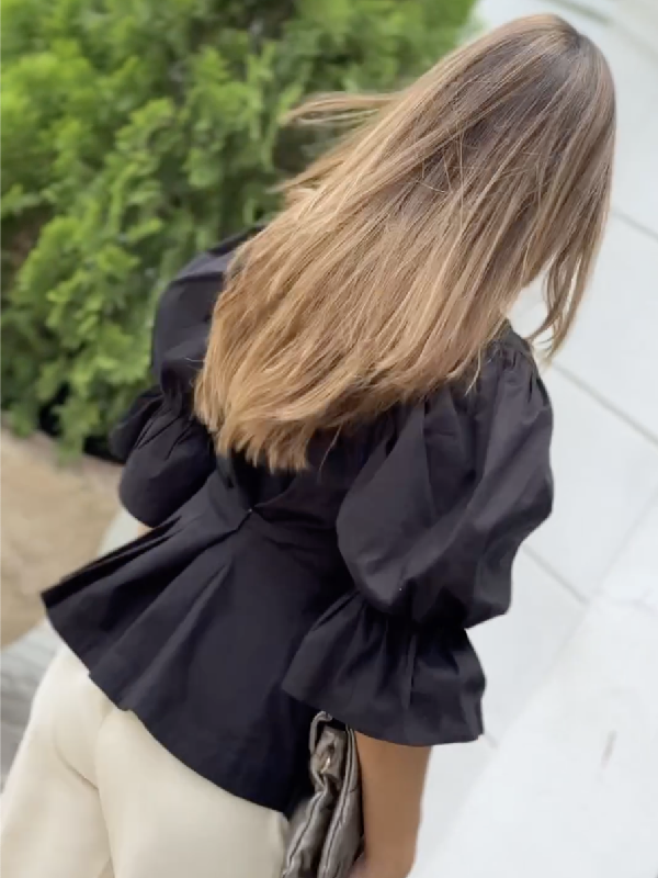 Chemisier asymétrique boutonné à ourlet plongeant, à manches bouffantes, à décolleté en V profond, couleur unie